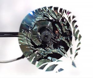 Shattering a CD in Slow-Mo