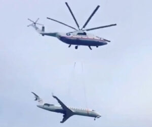 Helicopter Lifts a Jet Plane