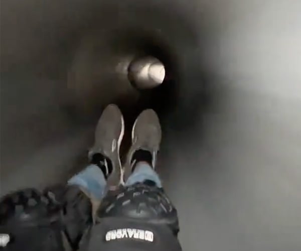 Skateboarding Through an Underground Drain Pipe
