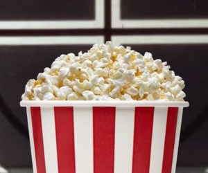 Why We Eat Popcorn at The Movies