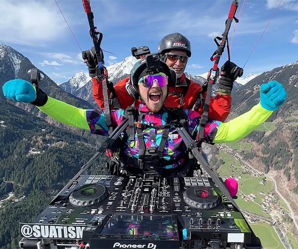 DJ Paraglides Over the Alps