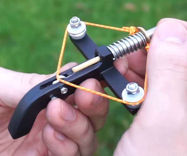http://theawesomer.com/making-a-tiny-spring-powered-crossbow/689145/