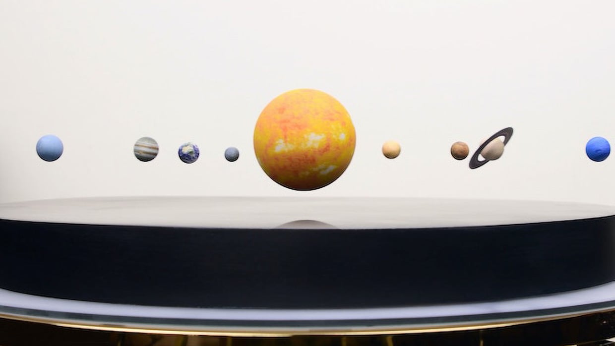 A Tiny Levitating Solar System for Your Desktop