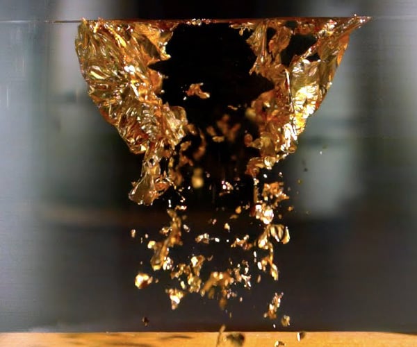 Exploding Gold in a Vacuum Chamber