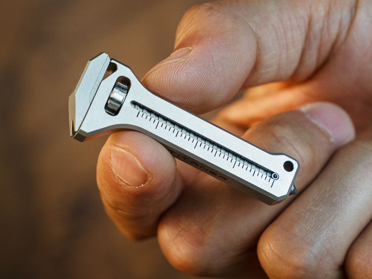 This Miniature Titanium Wrench is Also a Bottle Opener, Phone Stand ...