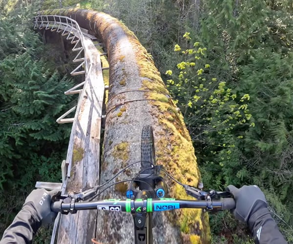 Riding a Mountain Bike on a Water Pipeline