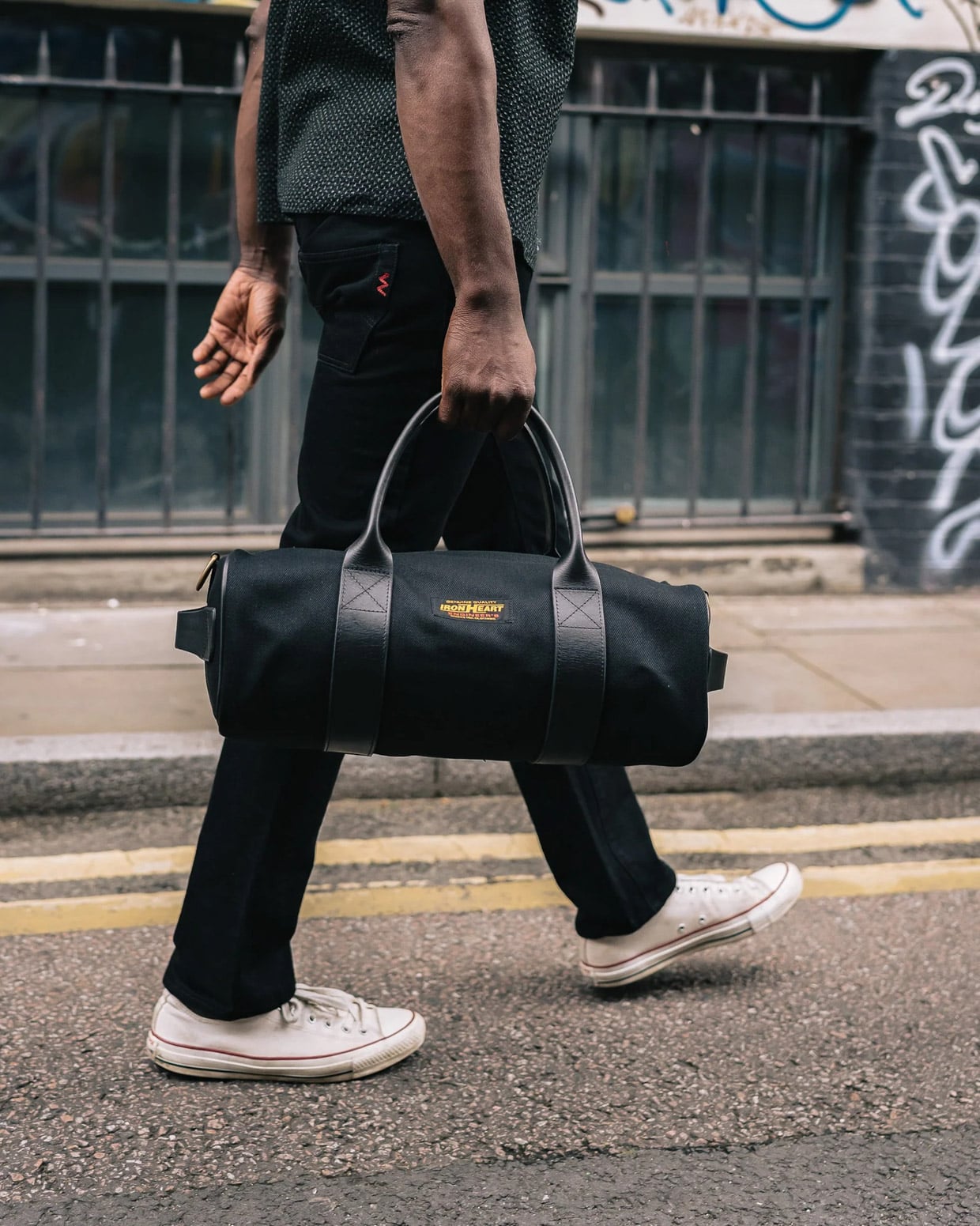 This Rugged Japanese Duffel bag Pairs Black Denim with Italian Leather